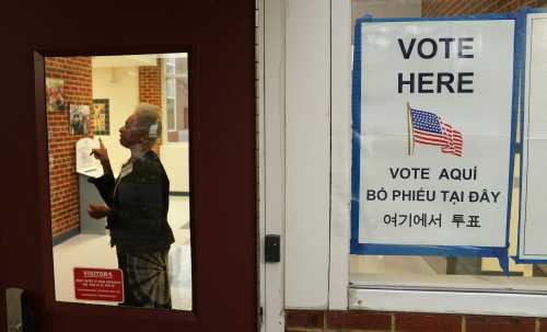 A polling station worker directs a voter to fill out their ballot on Election Day in Falls Church, Virginia, U.S., November 7, 2023. Credit: REUTERS/Kevin Lamarque