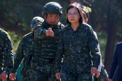 Taiwan's President Tsai Ing-wen listens to a briefing at a military camp that will be one of the training grounds for the new one year compulsory military service starting earlier next year in Taichung, Taiwan.