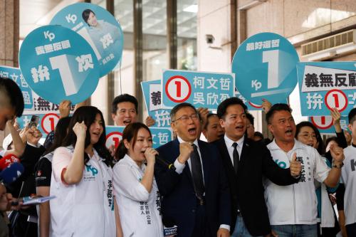 Ko Wen-je, Taiwan People's Party chairman and presidential candidate, shouts slogans next to supporters outside the Central Election Commission in Taipei, Taiwan December 11, 2023.