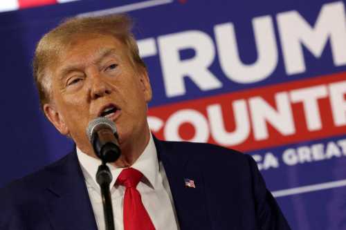 Former U.S. President and Republican presidential candidate Donald Trump rallies with supporters at a "commit to caucus" event at a Whiskey bar in Ankeny, Iowa, U.S. December 2, 2023. Credit: REUTERS/Carlos Barria//File Photo