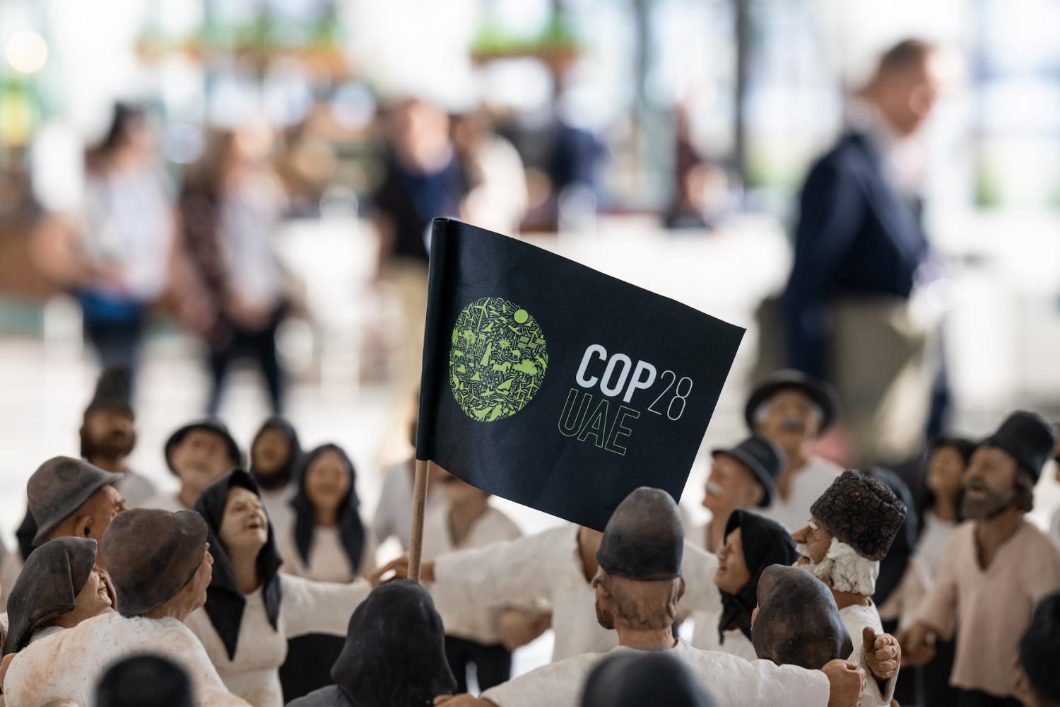 View of a "COP28UAE" flag in a hall.