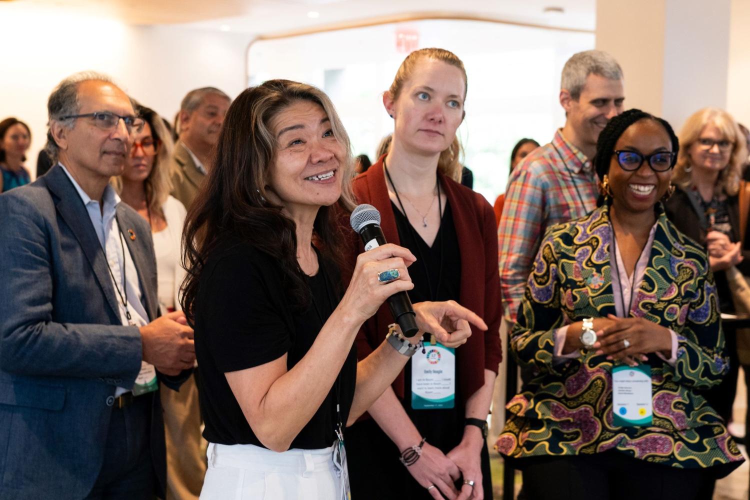 Room 5 co-lead Ito Peng shares her perspective in a group activity during the September 2023 17 Rooms community gathering on the eve of the U.N. General Assembly. Featuring (from left to right): Homi Kharas, Ito Peng, Emily Beagle, and Yakama Manty Jones. Photo by Ralph Alswang (on behalf of The Rockefeller Foundation).