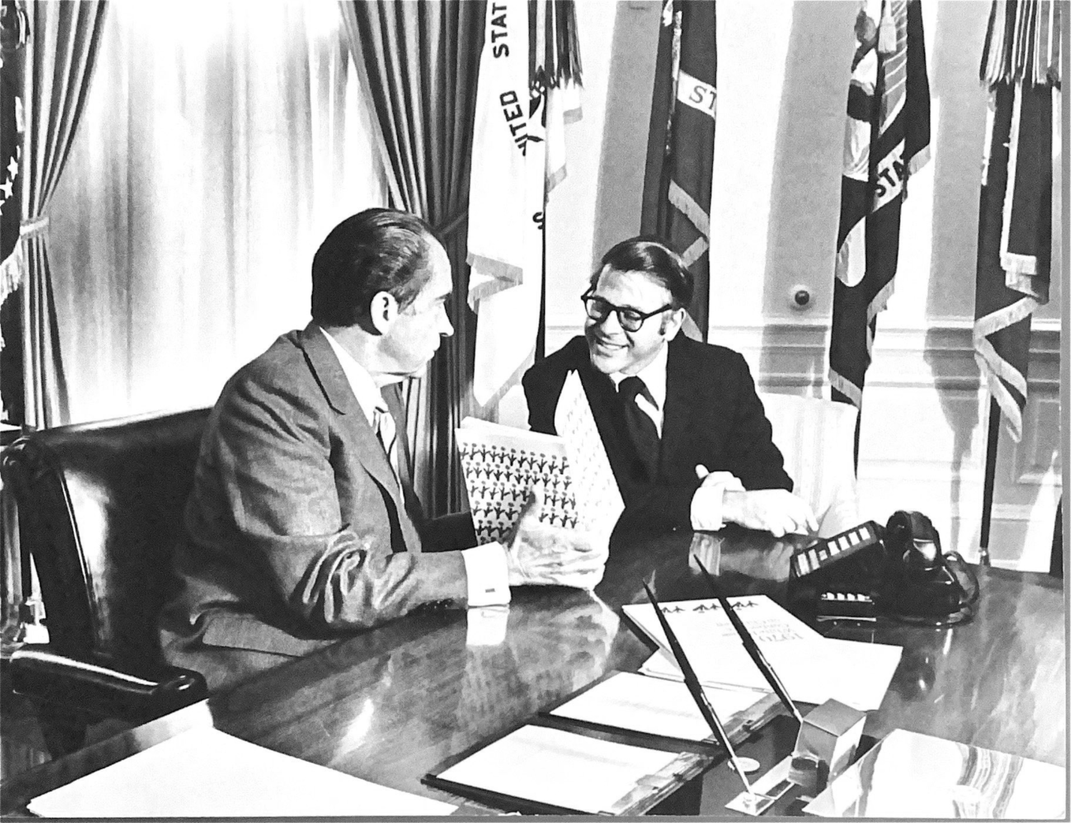 Steve Hess and President Nixon in the Oval Office discuss the White House Conference on Youth, 1970