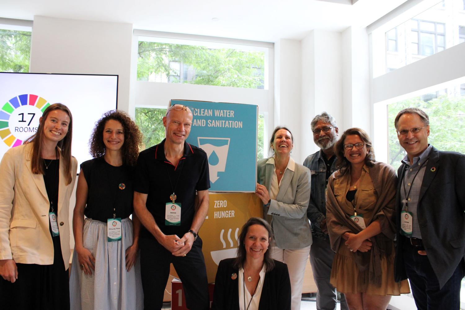 Participants in Room 6 pose together during the September 2023 17 Rooms community gathering. Featuring (from left to right): Morgan Booher, Jehanne Fabre, Henk Ovink, Danielle Gaillard-Picher, Kelly Ann Naylor, Sharif Jamil, Tania Strauss, and J. Carl Ganter. Photo by Junjie Ren (The Brookings Institution).