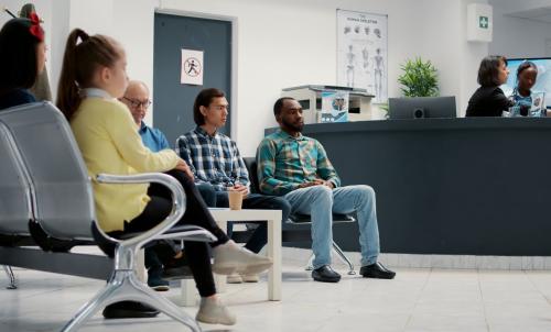 People of all ages in a public clinic waiting room