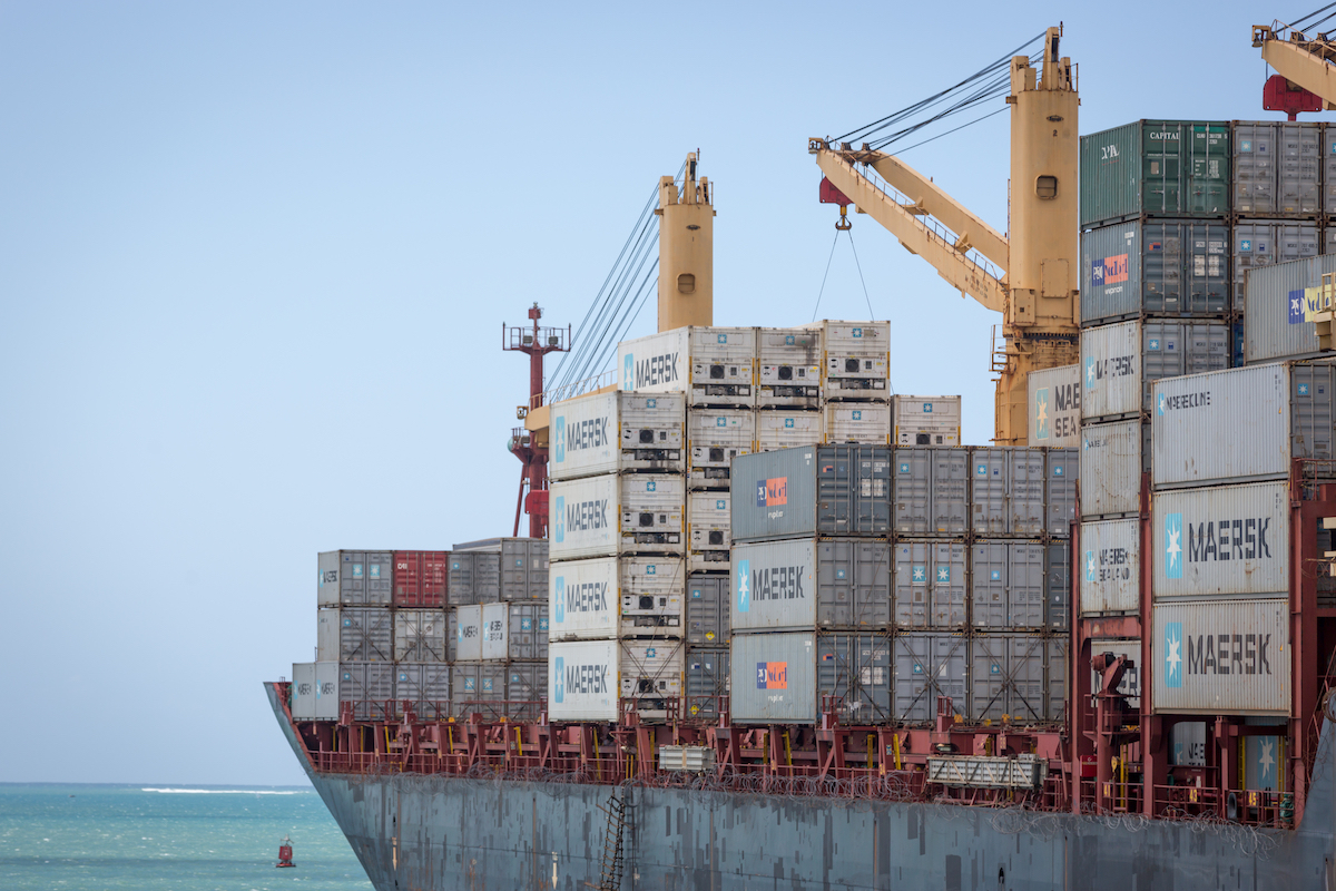 Large vessel ship carrying hundreds of containers in the Dar es Salaam area, Tanzania, Africa