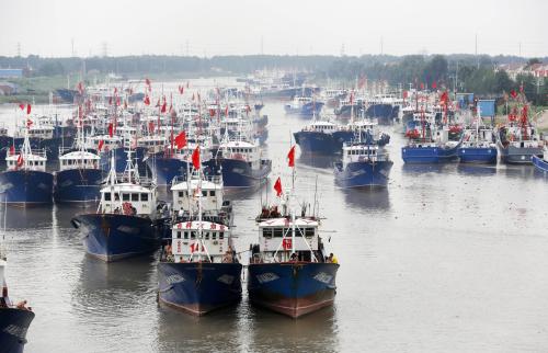 A fishing fleet departs from a harbor after the summer fishing moratorium ended in Lianyungang city, east China's Jiangsu province, August 1. 2016.