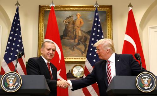 Turkey's President Recep Tayyip Erdogan (L) shakes hands with U.S President Donald Trump as they give statements to reporters in the Roosevelt Room of the White House in Washington, U.S. May 16, 2017. REUTERS/Kevin Lamarque