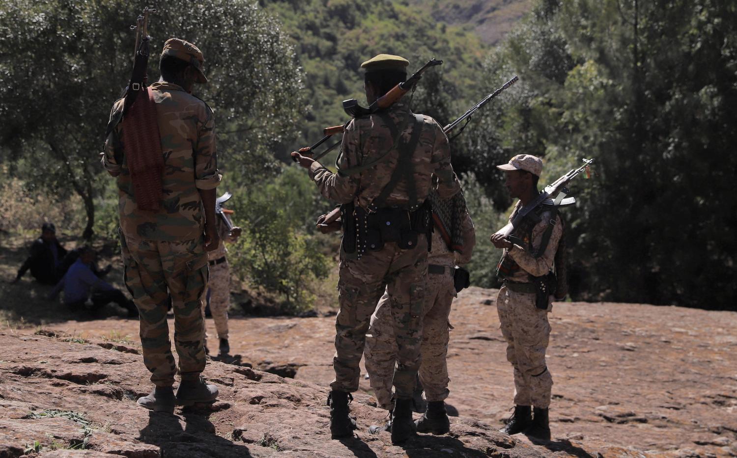Members of the Amhara Special Forces stand guard next to the Saint George rock-hewn church in the Lalibela town of the Amhara Region, Ethiopia, January 25, 2022.