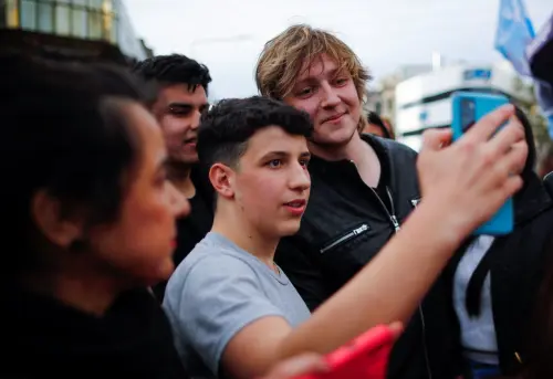 Inaki Gutierrez, who manages Argentine presidential candidate Javier Milei's TikTok, poses for a selfie with a supporter, after Milei's campaign rally in La Plata, on the outskirts of Buenos Aires, Argentina September 12, 2023.