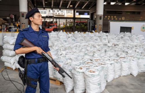 Customs officers guard suspected methamphetamine seized at the Kwai Chung Customhouse Cargo Examination Compound in Hong Kong, China, November 6, 2023.