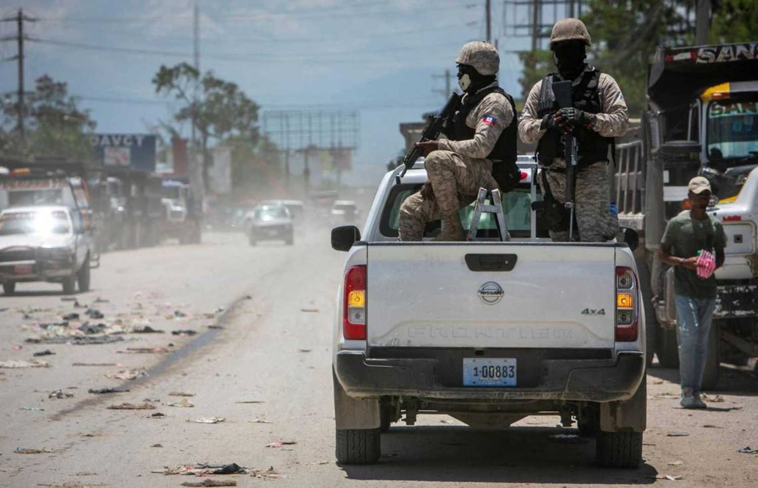 In 2022, Haiti police on patrol keep their eyes on traffic during a stop at a police checkpoint in Tabarre, near the U.S. Embassy, east of metropolitan Port-au-Prince. Gangs have taken control of neighborhoods in the vicinity. (José A. Iglesias/Miami Herald/TNS/ABACAPRESS.COM)