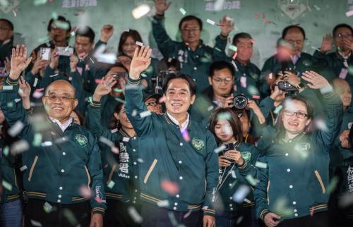 President-elect Lai Ching-te (L2) and Vice President-elect Hsiao Bi-khim (L3) of the Democratic Progressive Party wave to supporters after winning the election in Taipei, Taiwan on the evening of January 13, 2024.