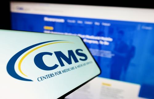 Computer and logo with Center for Medicare and Medicaid Services logo
