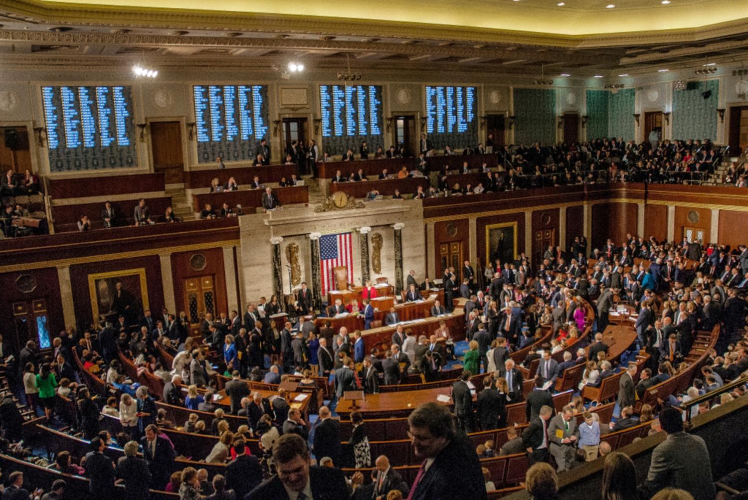 photo of floor of congress with members conversing