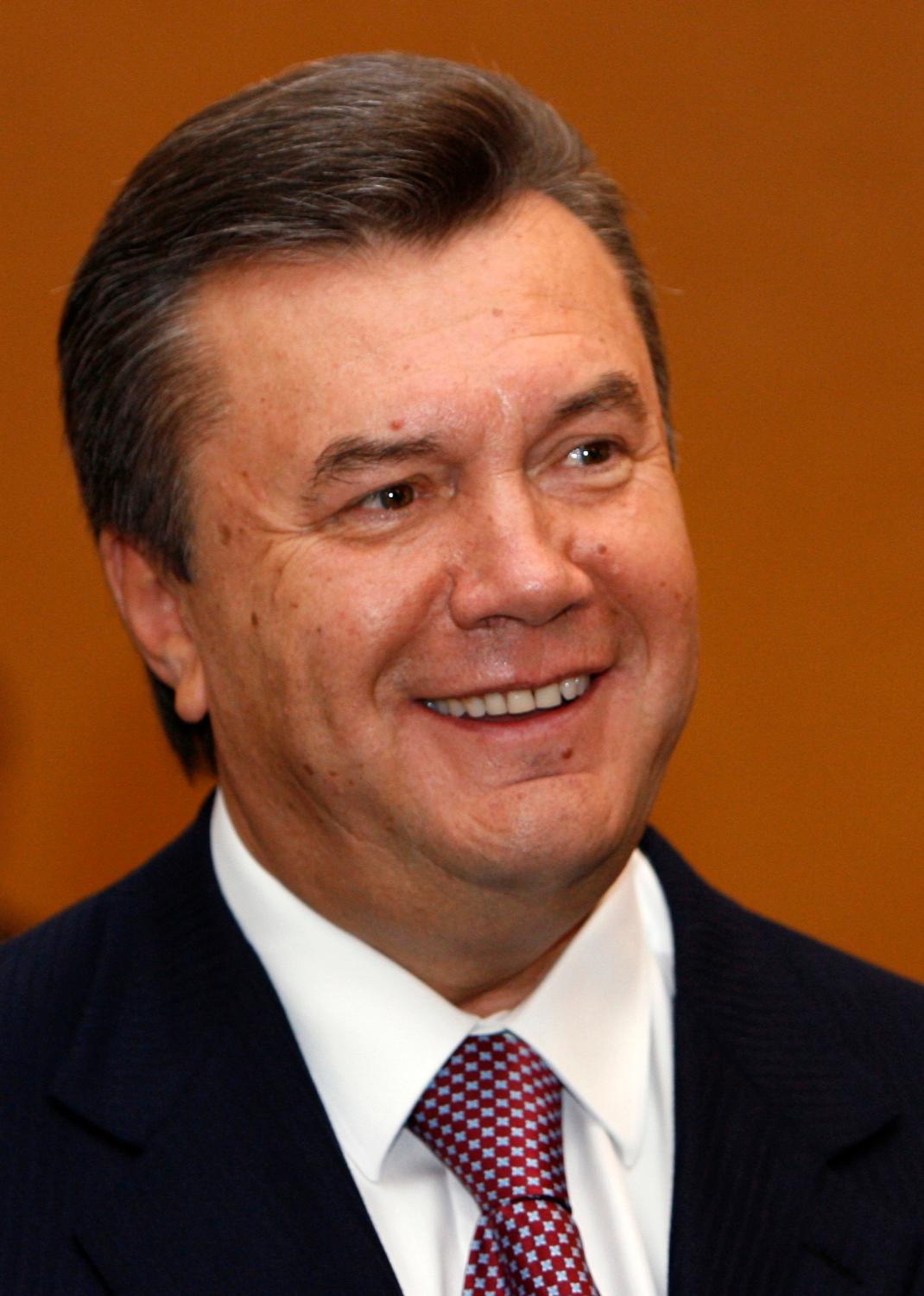 Ukraine's Prime Minister and Regions Party leader Viktor Yanukovich smiles as he talks to the media after voting during the parliamentary election at a polling station in Kiev September 30, 2007.