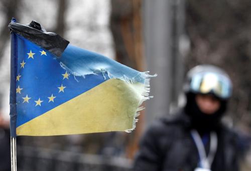 A black ribbon is attached to a flag, which combines EU and Ukrainian flags, to mark a day of mourning for the victims of clashes between anti-government protesters and Interior Ministry members in Kyiv February 22, 2014.
