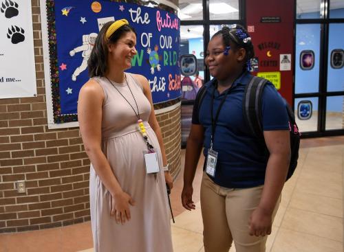Danya Laverack (left), a school counselor at Indian River Academy, hugs students on the first day of school, Thursday, Aug. 10, 2023, in Vero Beach. Students were greeted by teachers, first-year principal Kimberly Rahal, and Indian River County Superintendent David Moore as parents said their tearful goodbyes.