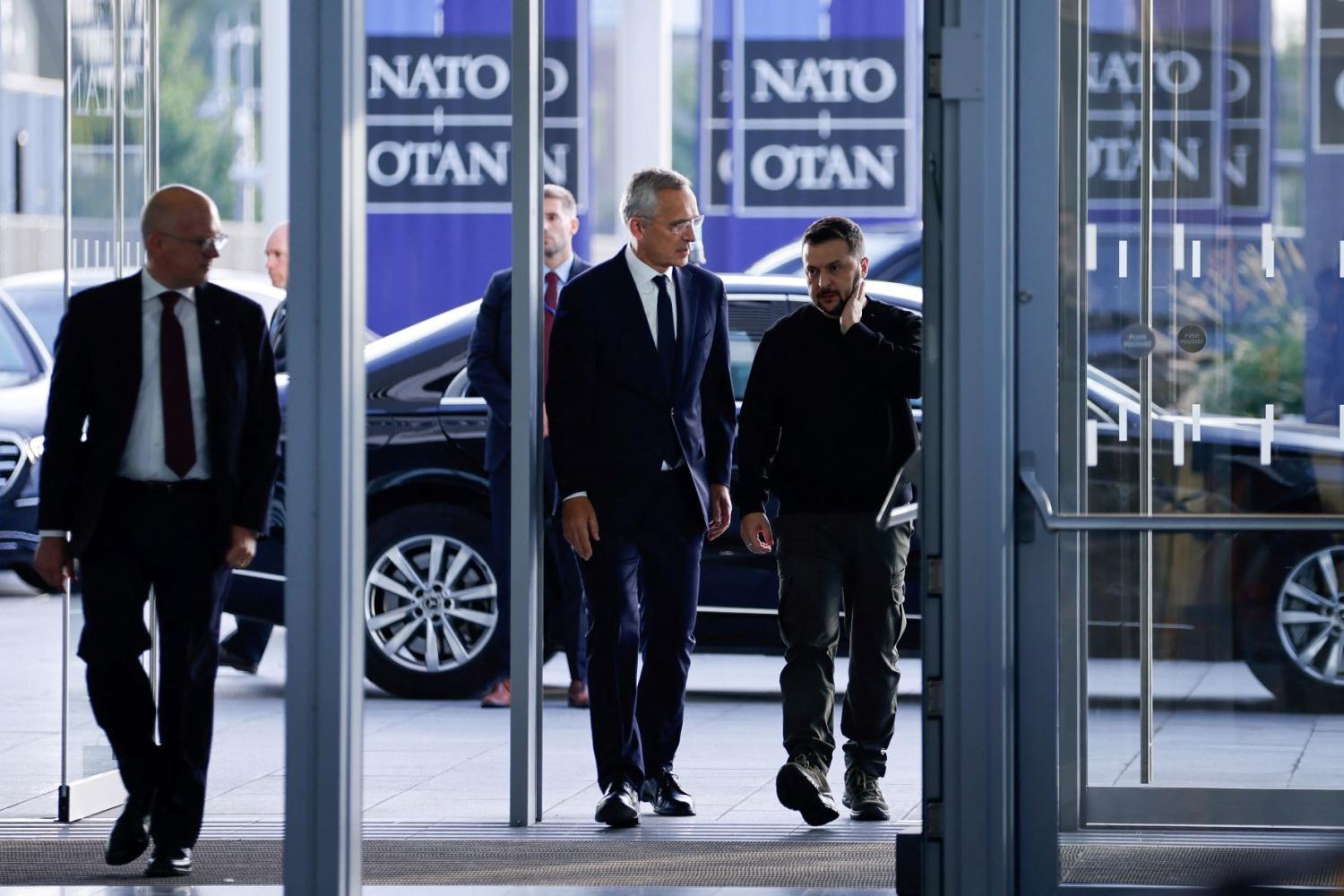 Ukrainian President Volodymyr Zelenskiy and Secretary General of NATO Jens Stoltenberg walk on the day of a NATO Defence Ministers' meeting at the Alliance's headquarters in Brussels, Belgium October 11, 2023.