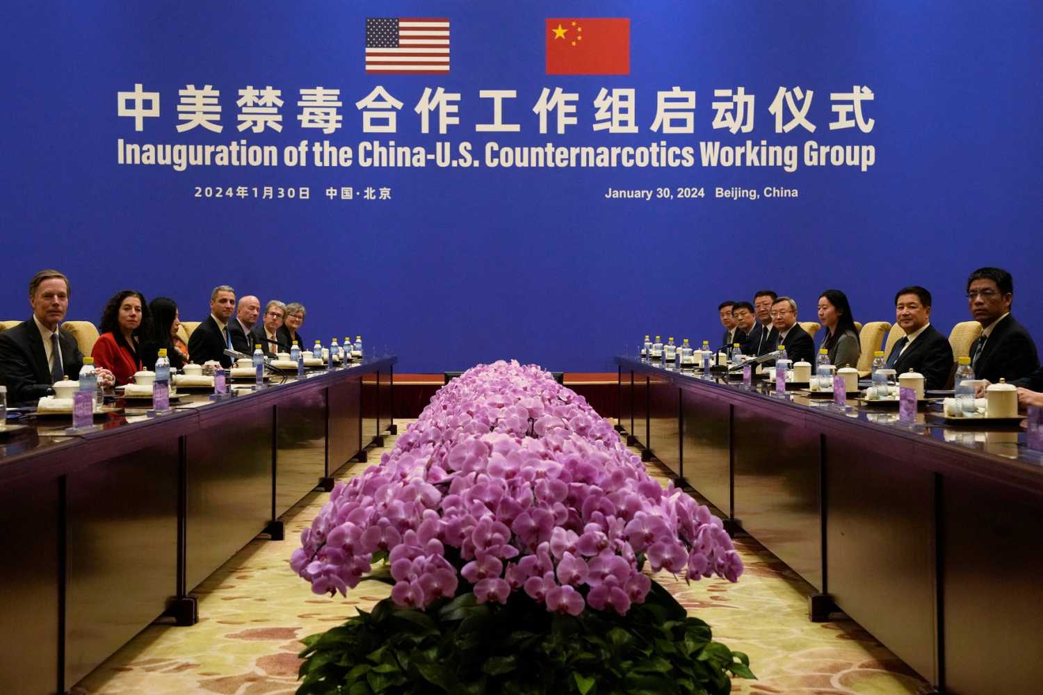 U.S. Deputy Assistant to the President and Deputy Homeland Security Advisor Jen Daskal and Chinese Minister of Public Security Wang Xiaohong look toward cameras before a meeting before a meeting at the Diaoyutai State Guesthouse in Beijing, Tuesday, Jan. 30, 2024.