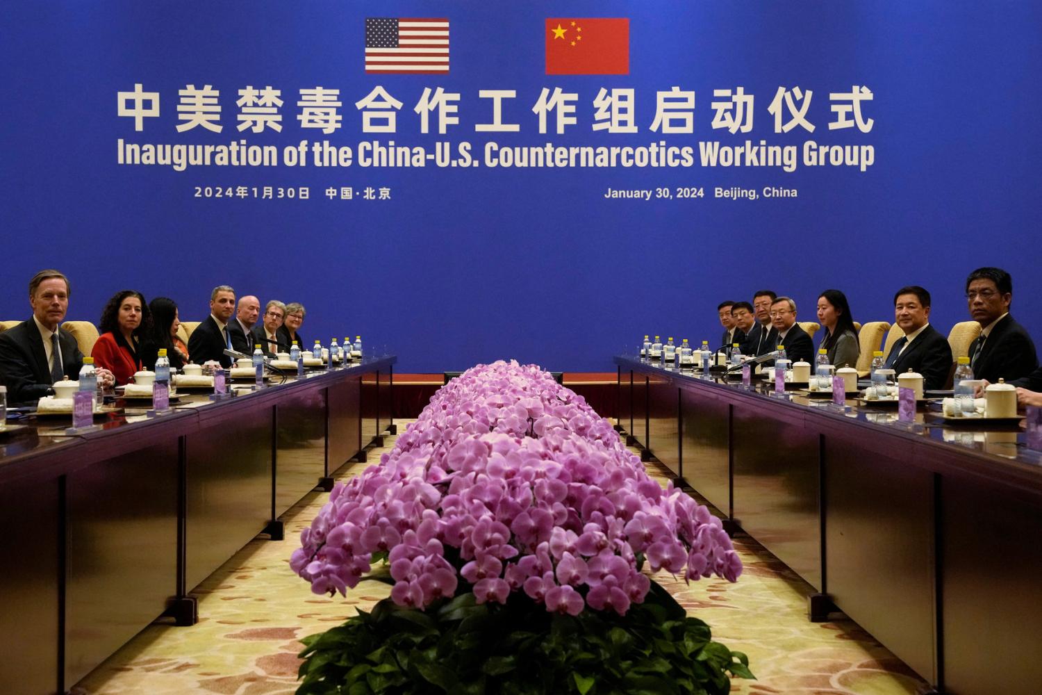 U.S. Deputy Assistant to the President and Deputy Homeland Security Advisor Jen Daskal and Chinese Minister of Public Security Wang Xiaohong look toward cameras before a meeting before a meeting at the Diaoyutai State Guesthouse in Beijing, Tuesday, Jan. 30, 2024.