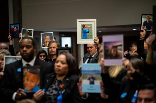 Family members of children who fell victim to dangers on social media hold family photos in protest, before a Senate Judiciary Committee hearing on big tech and child sexual exploitation, at the U.S. Capitol, in Washington, D.C., on Wednesday, January 31, 2024.