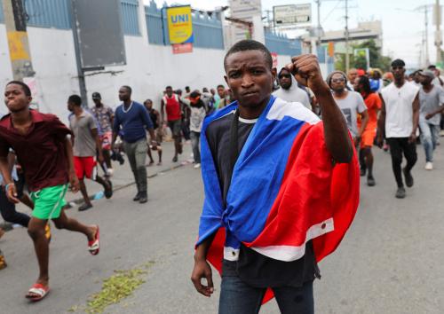 A demonstrator in the Haitian political scene gestures during a protest against the government calling for the resignation of Prime Minister Ariel Henry, in Port-au-Prince, Haiti February 5, 2024. REUTERS/Ralph Tedy Erol