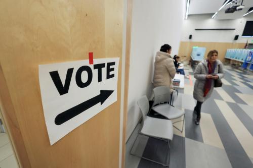 A voter leaves after casting her ballot in the state’s Democratic and Republican presidential primary election, held two days before a competing Republican presidential caucus, in Las Vegas, Nevada, U.S. February 6, 2024.