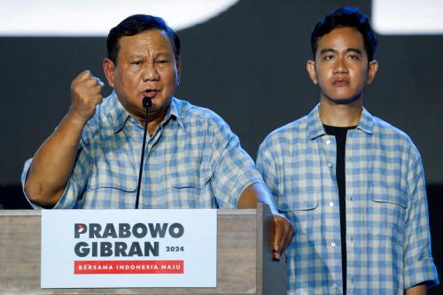 Indonesia's Defense Minister and leading presidential candidate Prabowo Subianto delivers his speech alongside his running mate Gibran Rakabuming Raka, the eldest son of Indonesian President Joko Widodo and currently Surakarta's mayor, as they claim victory after unofficial vote counts during an event to watch the results of the general election in Jakarta, Indonesia, February 14, 2024.