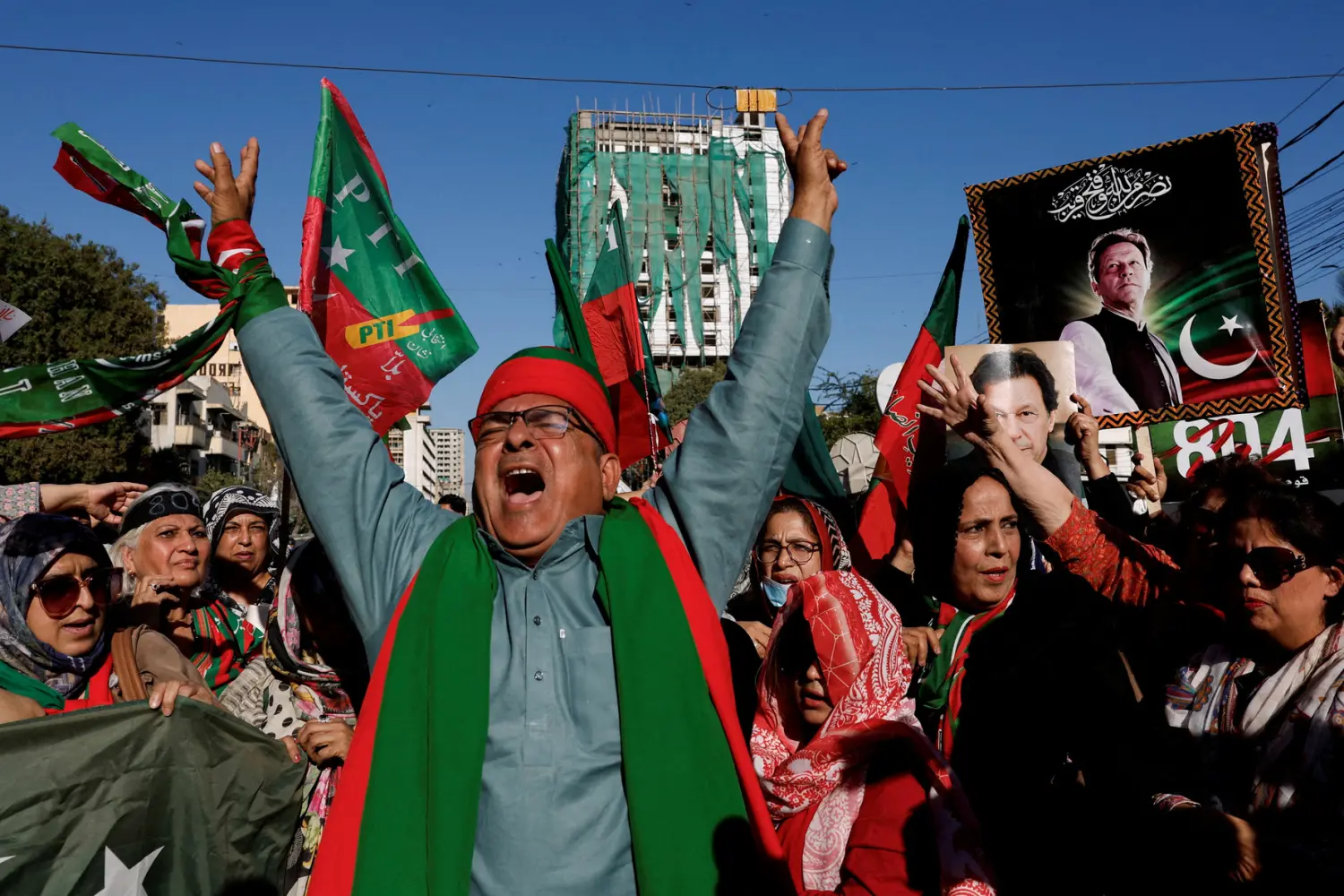 Supporters of former Prime Minister Imran Khan's party, the Pakistan Tehreek-e-Insaf (PTI), chant slogans as they gather during a protest demanding free and fair election results, outside the provincial election commission office in Karachi, Pakistan, February 17, 2024. REUTERS/Akhtar Soomro/File Photo