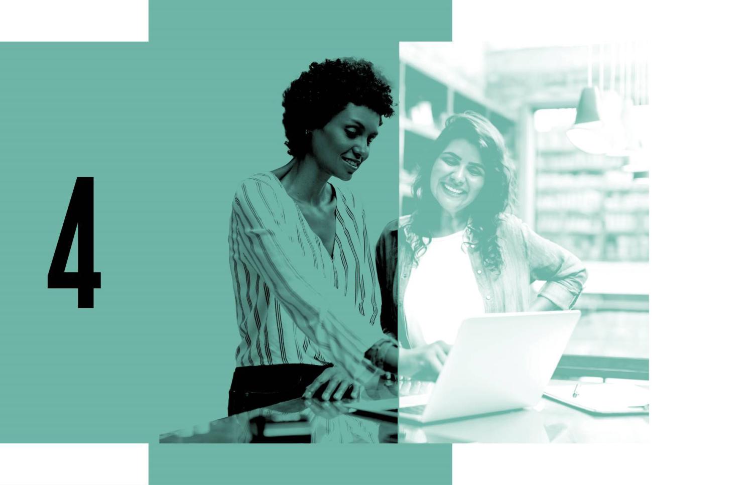 Women work on a computer in an office