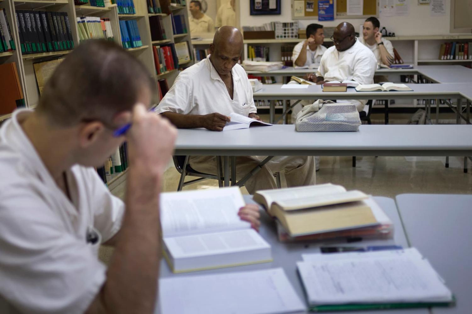 Students read books and write papers at a library inside the Southwestern Baptist Theological Seminary located in the Darrington Unit of the Texas Department of Criminal Justice men's prison in Rosharon, Texas August 12, 2014.