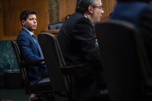 Samuel Altman, left, CEO, OpenAI, listens while Gary Marcus, right, Professor Emeritus, New York University, offers his opening statement during a Senate Committee on the Judiciary - Subcommittee on Privacy, Technology, and the Law oversight hearing.