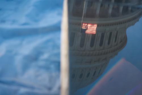 The U.S. Capitol building is seen reflected upon granite slabs during construction on Capitol grounds in Washington, D.C. on January 11, 2024. (Photo by Bryan Olin Dozier/NurPhoto)