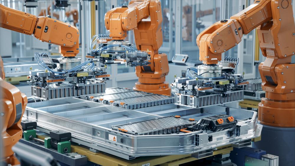 EV Battery Pack Automated Production Line Equipped with Orange Robot Arms. Electric Car Smart Factory. Row of Advanced Robotic Arms inside Bright Plant Assemble Batteries for Automotive Industry