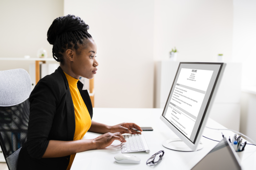 African woman Reading Resume Or CV Before Interview