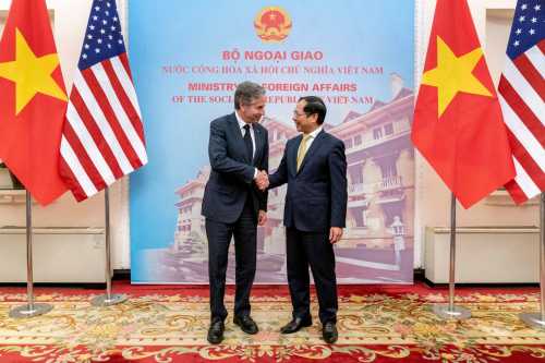Blinken and Son shake hands