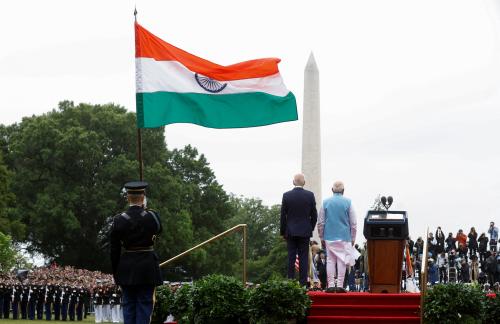 U.S. President Joe Biden and India’s Prime Minister Narendra Modi stand together onstage looking out towards the Washington Monument with India's flag flying behind them during the playing of their countries' national anthems at an official State Arrival Ceremony held at the start of Modi's visit to the White House in Washington, U.S., June 22, 2023.