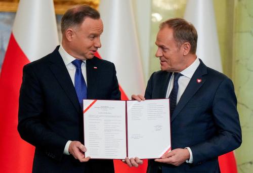 Polish President Andrzej Duda and newly appointed Polish Prime Minister Donald Tusk attend the cabinet swearing-in ceremony at the Presidential Palace in Warsaw, Poland, December 13, 2023. REUTERS/Aleksandra Szmigiel