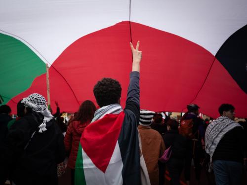 People march under an enormous Palestinian flag against Israel's planned ground invasion of Rafah, Gaza, where approximately 1.5 million Palestinians have taken shelter after following Israel’s orders to evacuate to the south, Washington, DC, March 2, 2024. The event is part of a worldwide demonstration of solidarity with Gaza, which is expected to draw millions of people from roughly 100 cities.