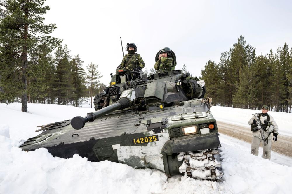 Swedish soldiers operate on a Combat Vehicle 90 during training with Finnish hunting units as part of NATO's Nordic Response exercise, in Hetta, Finland, March 5, 2024.
