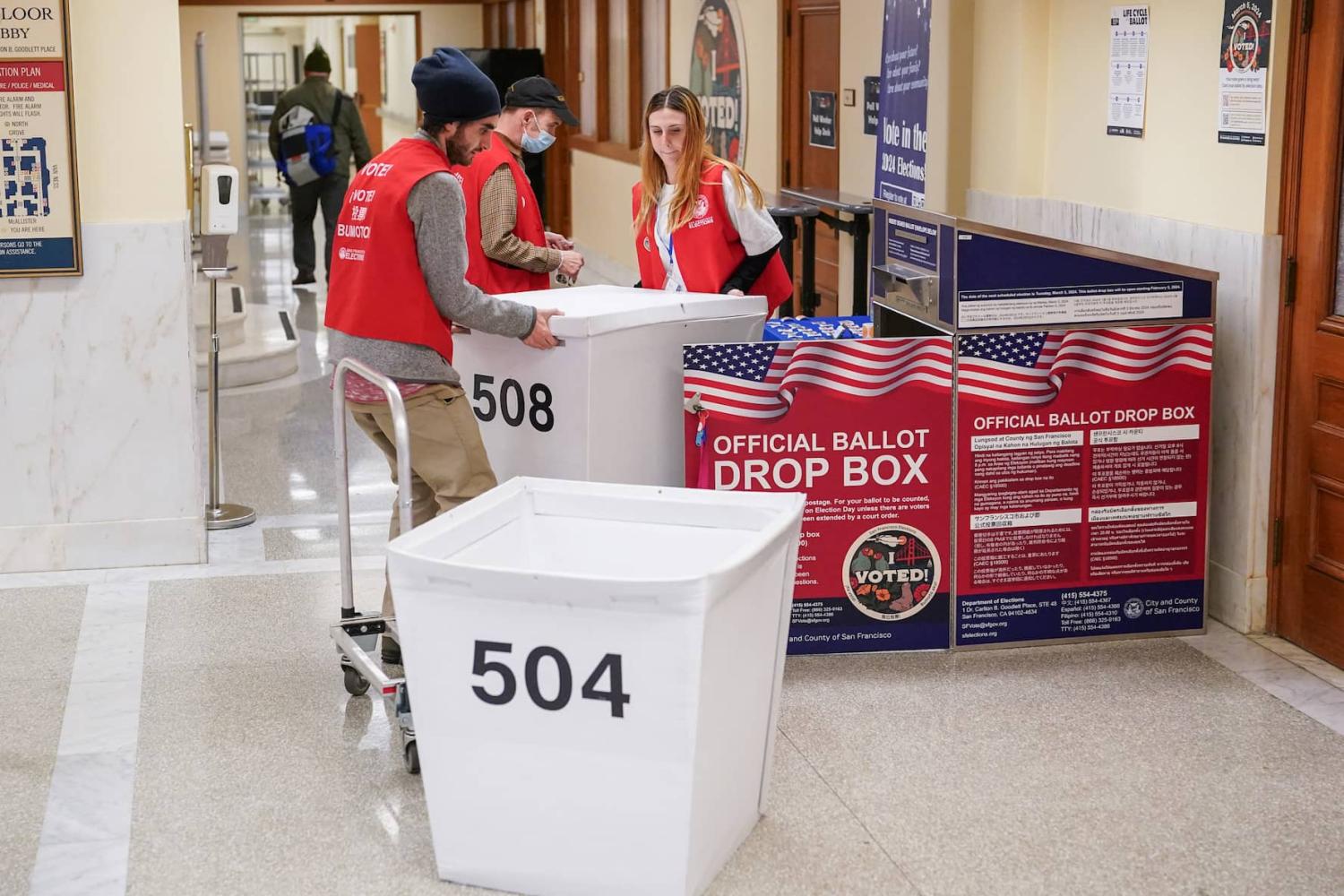 Department of Elections workers transport a box of ballots at the San Francisco City Hall voting center during the Super Tuesday primary election in San Francisco, California, U.S. March 5, 2024. Department of Elections workers transport a box of ballots at the San Francisco City Hall voting center during the Super Tuesday primary election in San Francisco, California, U.S. March 5, 2024.