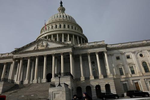 People walk past the U.S. Capitol building in Washington, U.S., January 18, 2024.