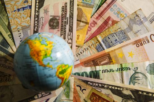 Globe on money from around the world.