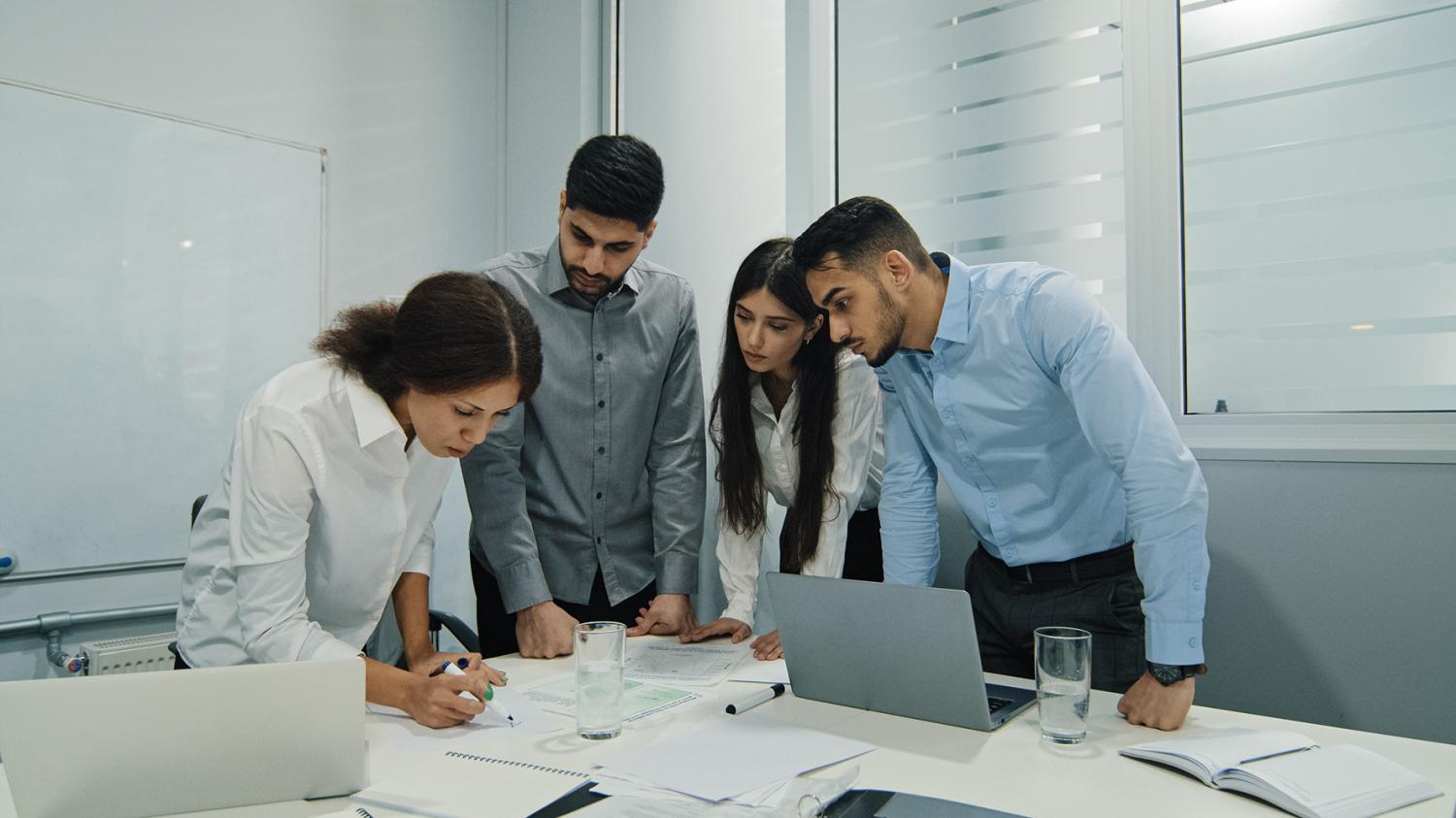 Woman team leader, successful employee mentor training diversity subordinates at corporate workshop presentation. Female business coach top manager presenting new project plan at conference office