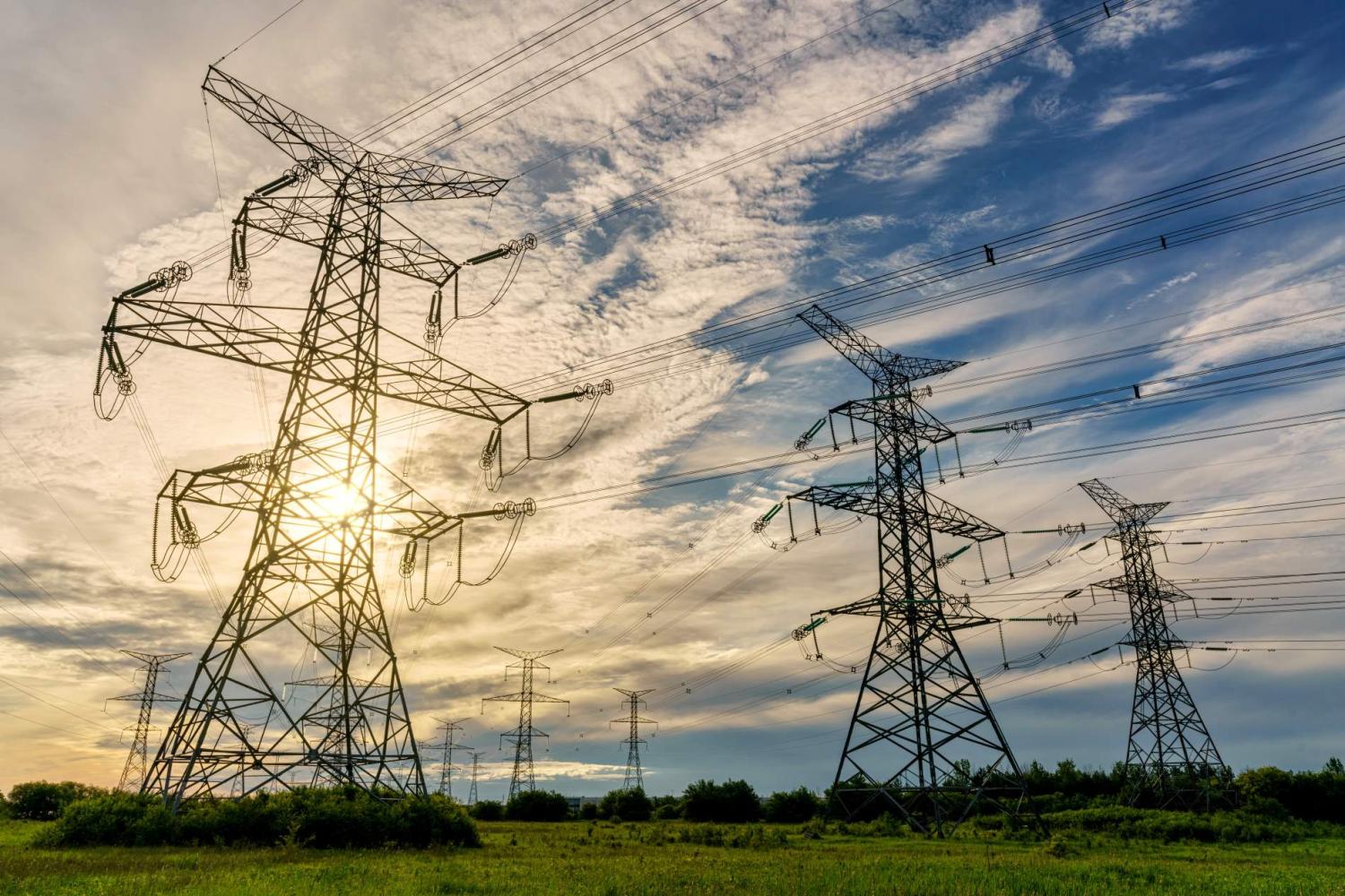 A look up at power lines in Ontario, Canada, at sunrise