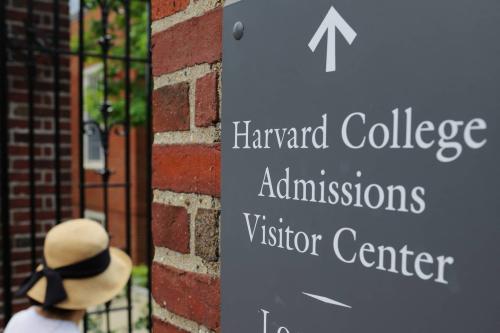 A sign points the way to the Harvard College Admissions Visitors Center at Harvard University in Cambridge, Massachusetts, U.S., July 6, 2023.