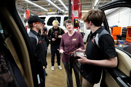 Superintendent of the Department of Public Instruction, Jill Underly talks with students in an advanced autos class at Grafton High School in Grafton on Tuesday, Feb. 6, 2024. The Department of Public Instruction and the state legislature have recently focused efforts on rebranding career and technical education in Wisconsin.