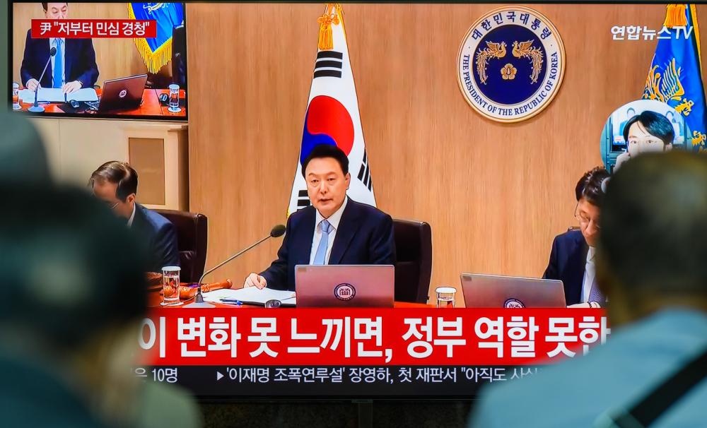 South Korea's 24-hour Yonhap News TV shows South Korean President Yoon Suk Yeol speaking during a cabinet meeting. Yoon humbly accepted the public sentiment revealed in the parliamentary election and said he would strive to improve communication with the people.