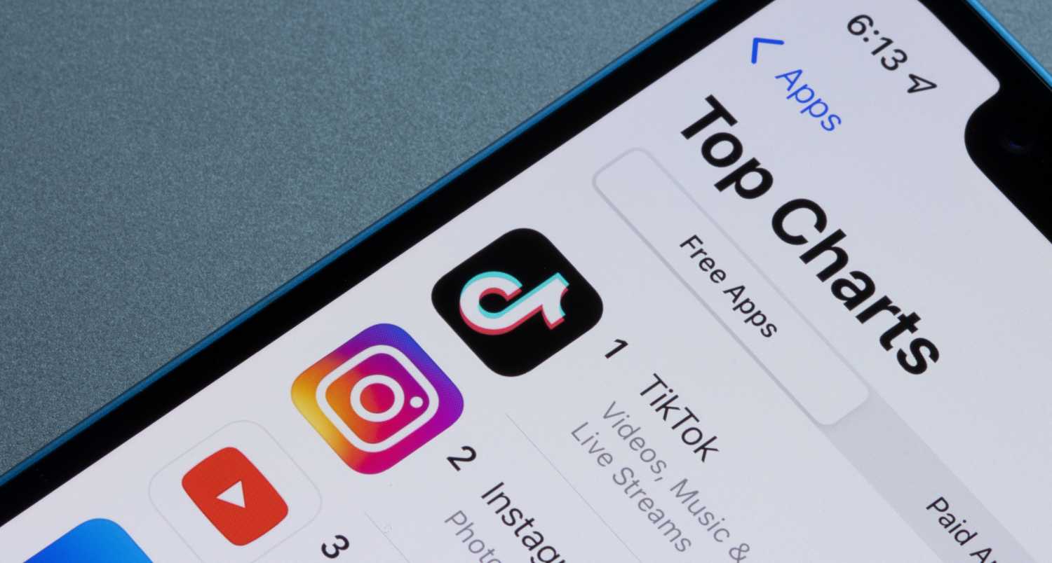 App Store top charts ranking for free iOS apps are seen on an iPhone.